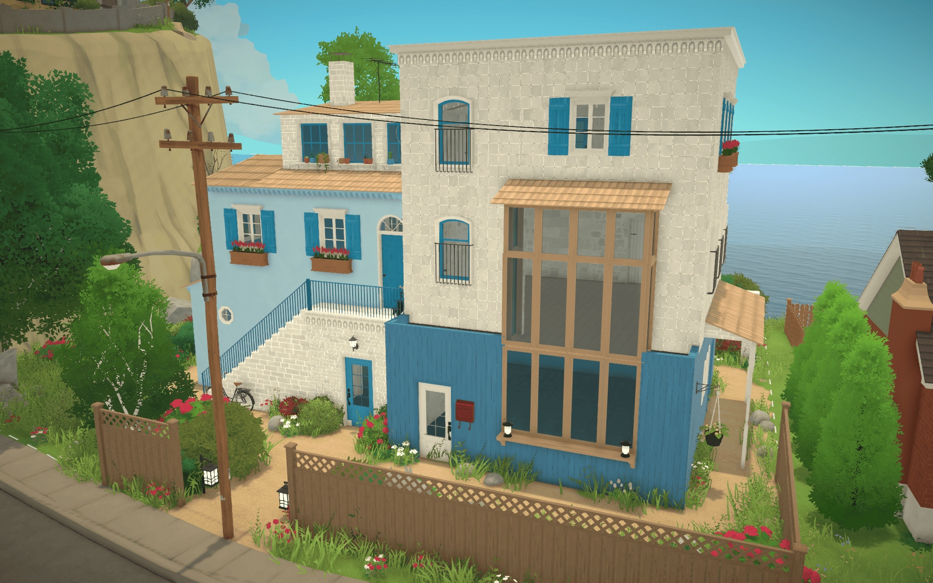 Mediterranean blue house next to the beach image 1